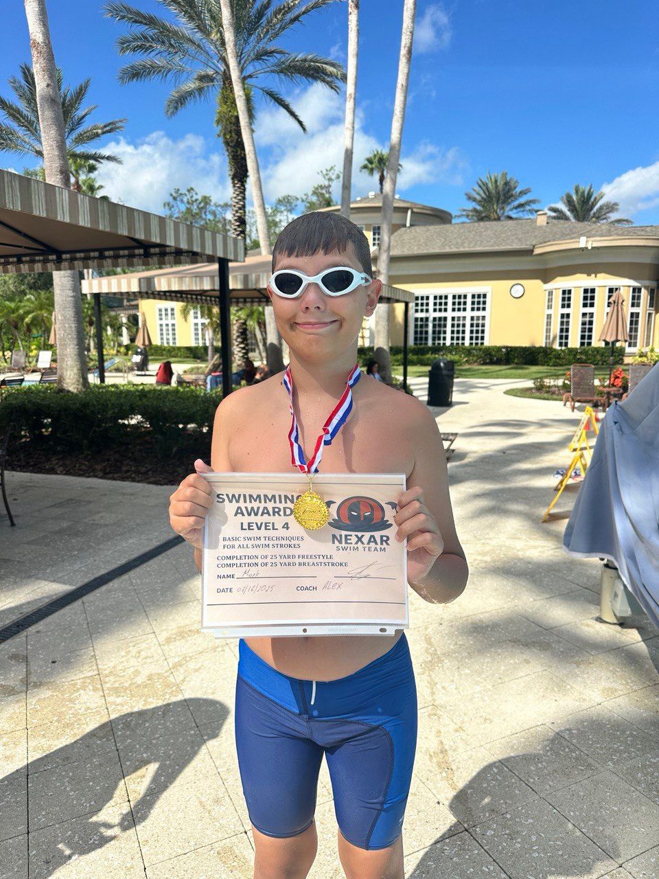NEXAR Swim Team swimmer with Level 4 award